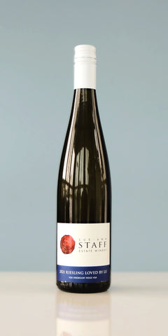 Wine bottle with a white label on a light gray background