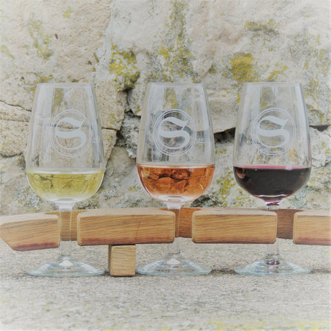 Business Class Tasting Flight image of three glasses of wine. 