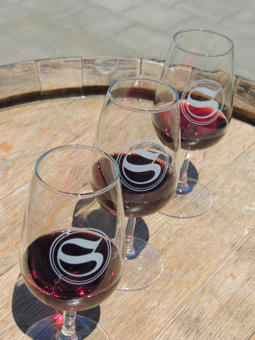 First class tasting flight image of three glasses of red wine
