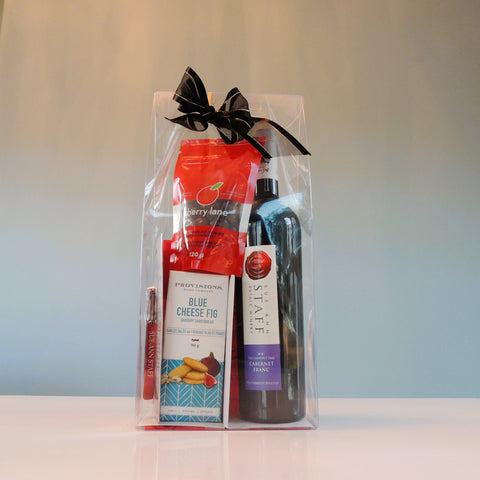 Just Add Cheese Gift Pack includes a bottle of wine, savoury shortbreads, dark chocolate covered cherries and a corkscrew!