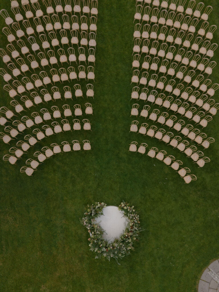 Aerial photo of wedding ceremony set up by Morning Light Photography
