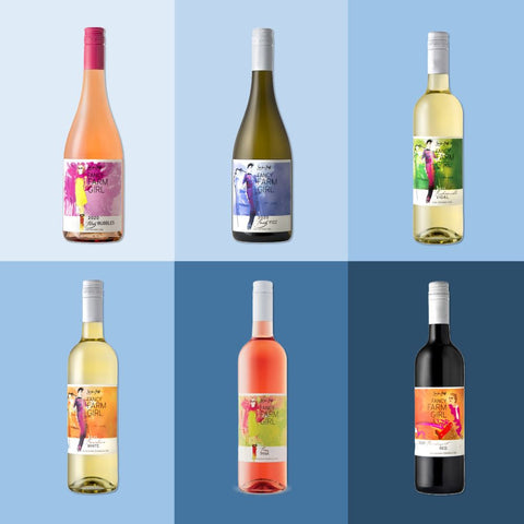 Six wine bottles with colorful labels on a blue background