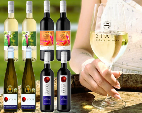 Collage of 8 bottles of wine superimposed over a photo of a young woman's hand holding the stem of a glass of white wine.