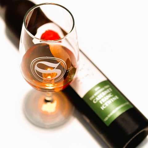 bottle of Wisteria Tree Cabernet Franc Icewine with an iso glass
