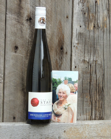 A photo of Sue-Ann's grandmother and mentor, Lula Staff, beside a bottle of her namesake wine. 