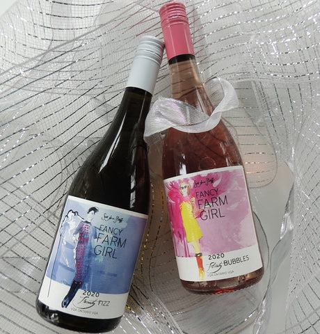 a bottle each of our Fancy Farm Girl Flirty Bubbles sparkling rosé and Frosty Fizz sparkling wine